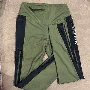 Pink green and black leggings size XS with side pockets and mesh material